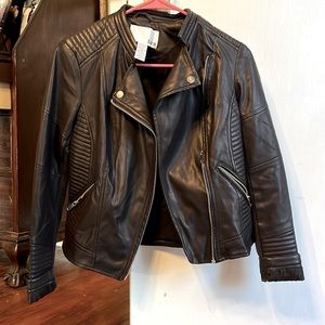 Jacket size xs. Deep purple in color. Sits at waist.